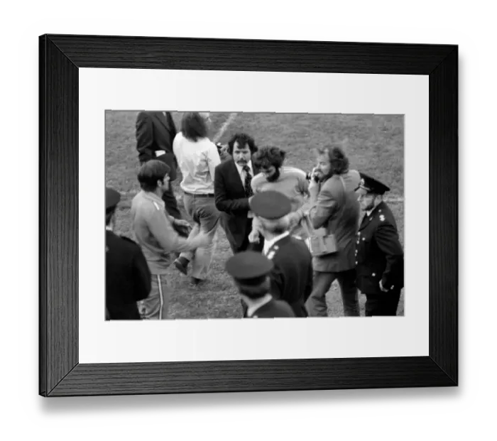 Framed Print : George Best being escorted off the pitch by Manager Barry Fry