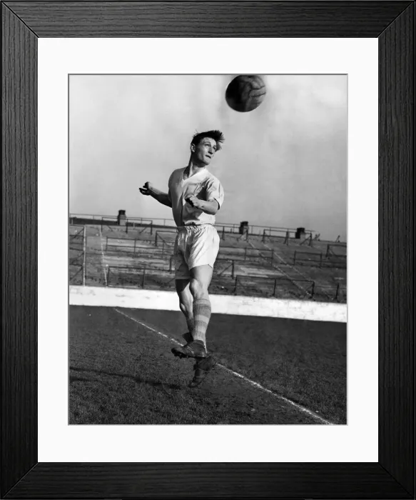 Framed Print : Dennis Fidler, the Manchester City outside left heading the ball during a training Framed Print : Dennis Fidler, the Manchester City outside left heading the ball during a training