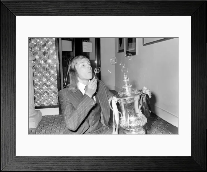 Framed Print : West Ham footballer Alan Taylor blowing bubbles as he celebrates his teams FA Cup victory