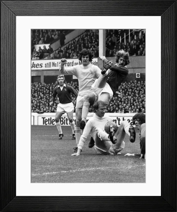 Framed Print : A wild swing from Evertons John Connolly when challenged by Joe Jordan Framed Print : A wild swing from Evertons John Connolly when challenged by Joe Jordan