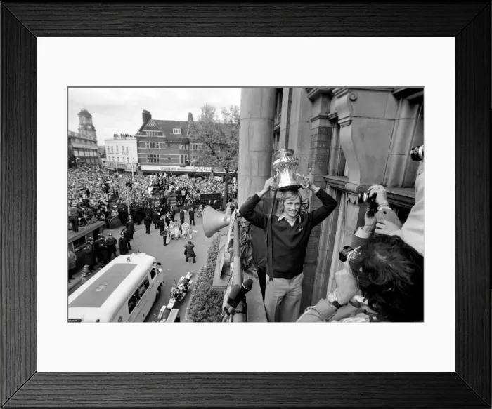 Framed Print : West Hams Alan Taylor showing off the trophy to fans gathered below at Newham Town Framed Print : West Hams Alan Taylor showing off the trophy to fans gathered below at Newham Town