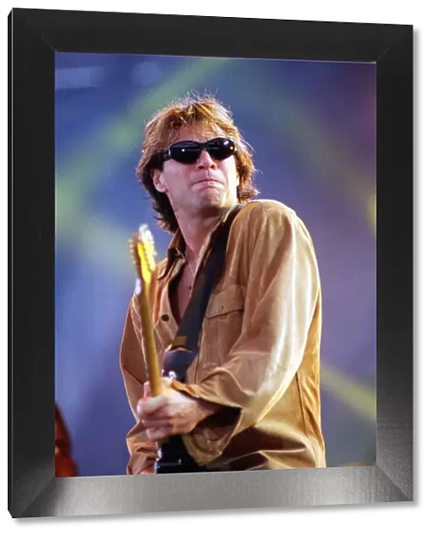 Jon Bon Jovi on stage at Ibrox playing guitar 1996