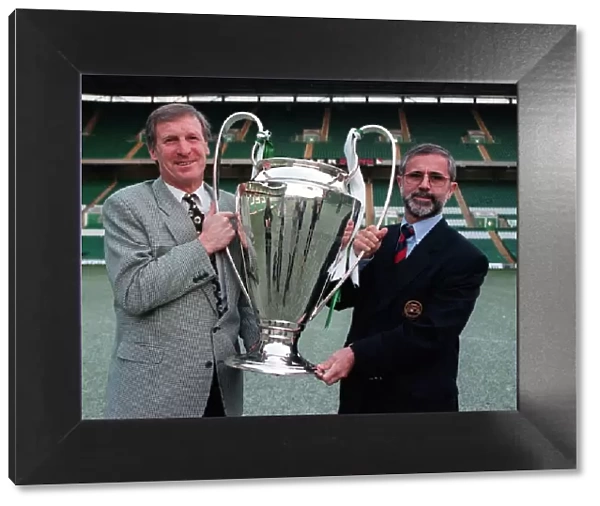 Billy McNeill and Gerd Muller holding the European Cup looking forward to the Bayern