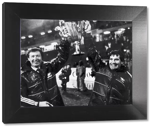 Aberdeen manager Alex Ferguson and assistant Archie Knox holding the European Cup Winners