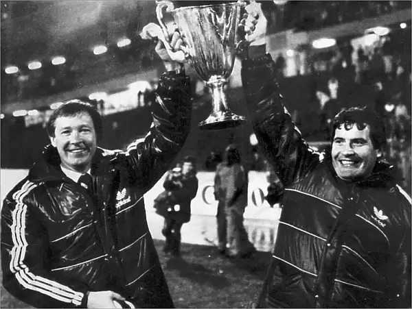 Aberdeen manager Alex Ferguson and assistant Archie Knox holding the European Cup Winners