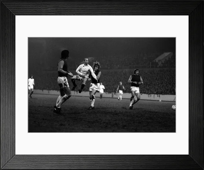 Framed Print : Bobby Charlton in mid air as he shoots for goal against West Ham at Upton Park during Framed Print : Bobby Charlton in mid air as he shoots for goal against West Ham at Upton Park during