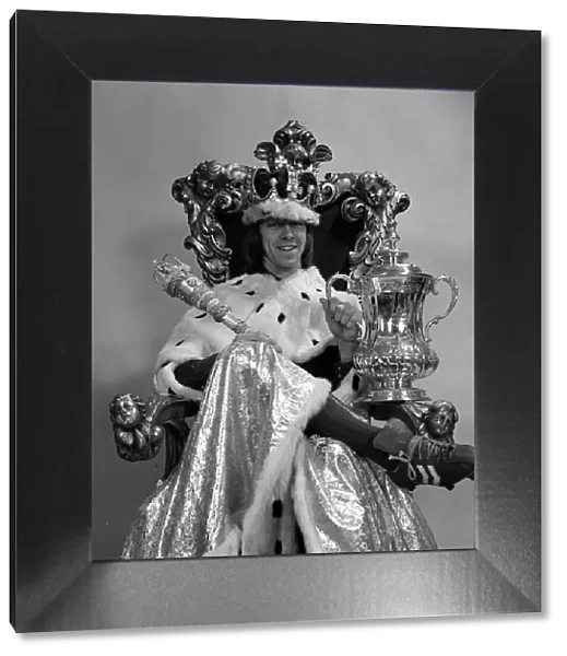 Charlie George with FA cup sitting on the throne 1972