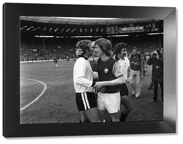 Bobby Moore is congratulated by Kevin Locke at Wembley after the 1975 FA Cup Final