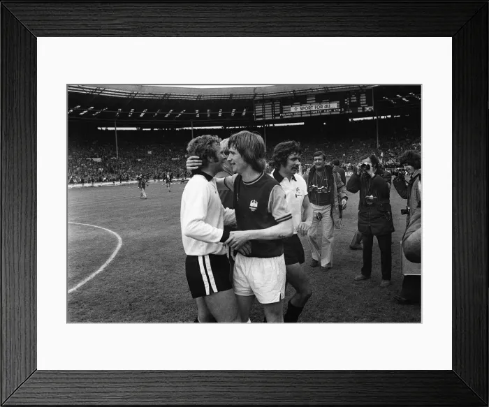 Framed Print : Bobby Moore is congratulated by Kevin Locke at Wembley after the 1975 FA Cup Final Framed Print : Bobby Moore is congratulated by Kevin Locke at Wembley after the 1975 FA Cup Final