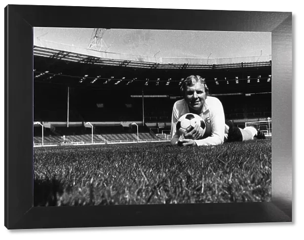 Fulham footballer Bobby Moore lying on the Wembley turf in an empty stadium before