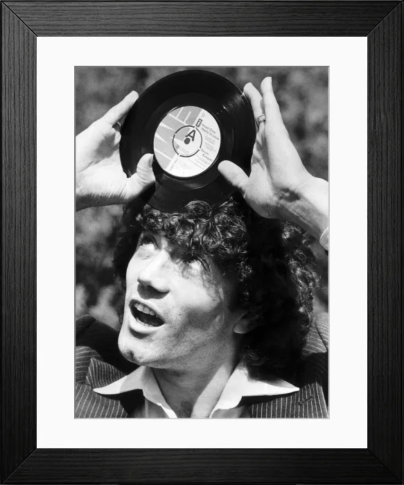 Framed Print : Footballer Kevin Keegan with the record he has cut called Head over Heels in Love