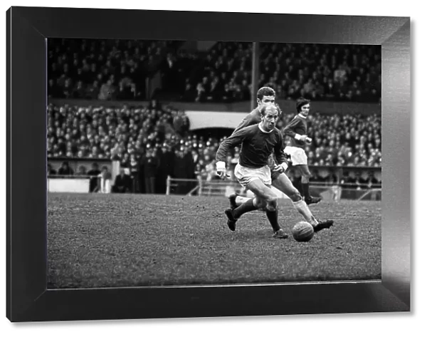 Bobby Charlton in action for Manchester United against Chelsea at Stamford Bridge