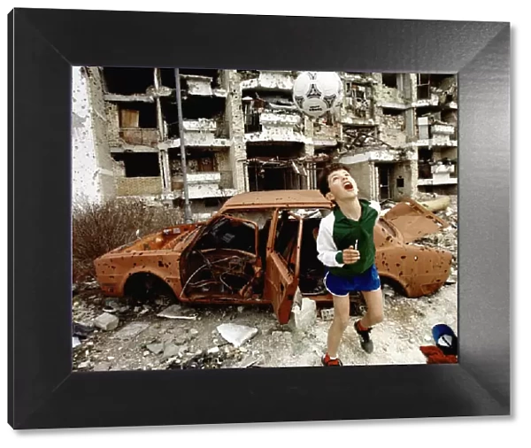 Mike Moore Award. Feature Photographer of the Year winning photo shows a boy playing in
