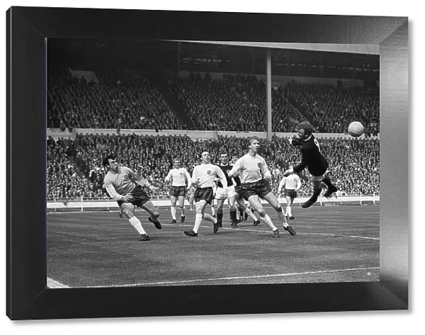 England goalkeeper Gordon Banks, Nobby Stiles and Jack Charlton watch as Billy Bremner