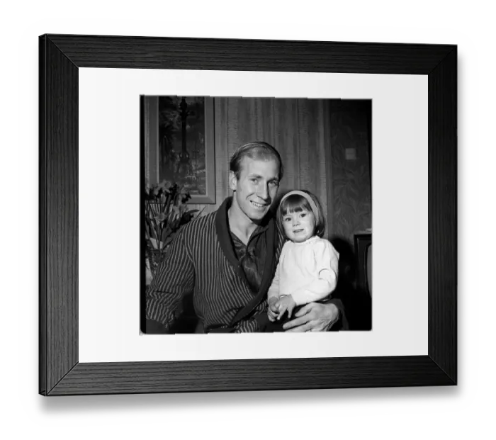 Framed Print : Manchester United footballer Bobby Charlton with daughter Suzanne at home March Framed Print : Manchester United footballer Bobby Charlton with daughter Suzanne at home March