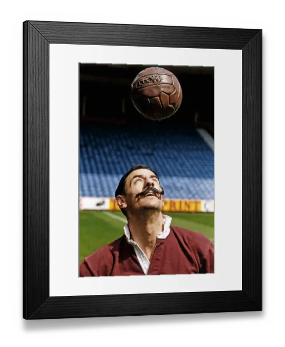 Framed Print : Liverpool footballer Ian Rush wears the Liverpool strip of 100 years ago including fake