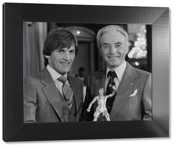 Liverpool star Kenny Dalglish recieves the Footballer of the year award from Stanley