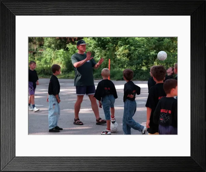 Framed Print : Jerome Flynn actor visits Bosnia and plays football with the children