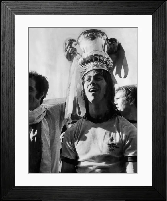 Framed Print : Charlie George footballer for Arsenal with the FA cup trophy after Arsenal beat Liverpool