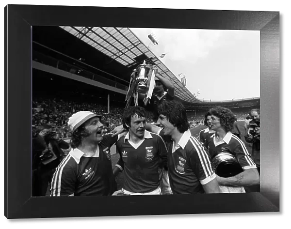 Ipswich team celebrate with the trophy after beating Arsenal in FA cup final may 1978