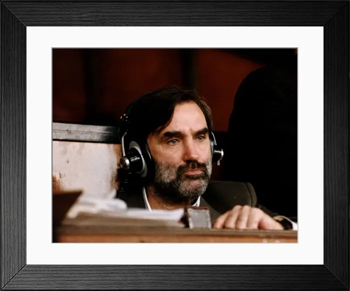 Framed Print : George Best former footballer wearing headphones commentating on a match for the radio Framed Print : George Best former footballer wearing headphones commentating on a match for the radio