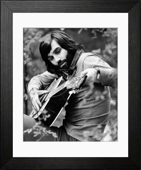 Framed Print : George Best seen here tuning his guitar May 1974 Framed Print : George Best seen here tuning his guitar May 1974