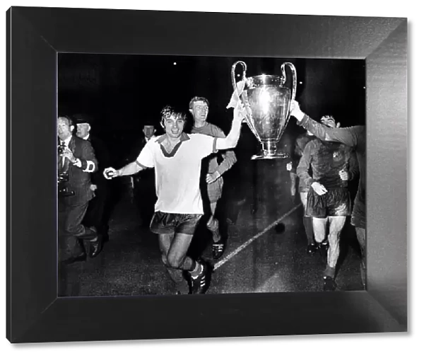 George Best Manchester United parading the European Cup after beating Benfica at Wembley