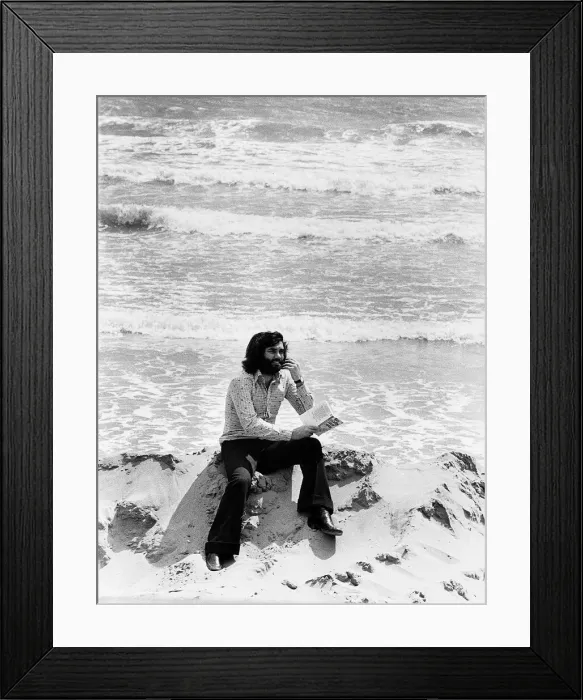 Framed Print : George Best alone with his thoughts on a deserted spanish beach Circa 1974 Framed Print : George Best alone with his thoughts on a deserted spanish beach Circa 1974