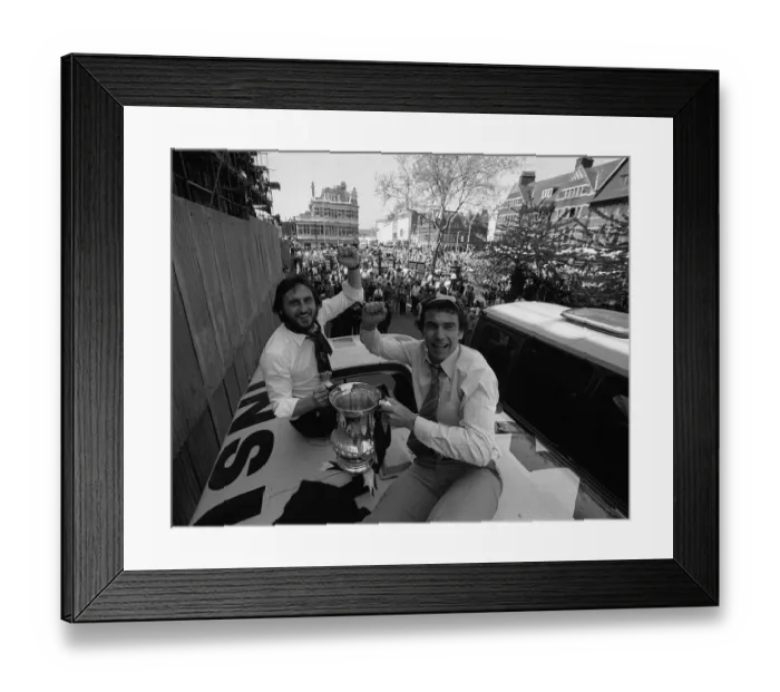 Framed Print : Trevor Brooking and Frank Lampard hold the FA Cup on top of the parade coach on arriving Framed Print : Trevor Brooking and Frank Lampard hold the FA Cup on top of the parade coach on arriving