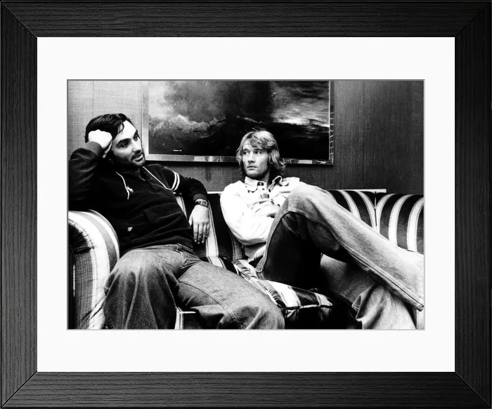 Framed Print : George Best and Rodney Marsh together on sofa circa 1976 who are both playing together Framed Print : George Best and Rodney Marsh together on sofa circa 1976 who are both playing together