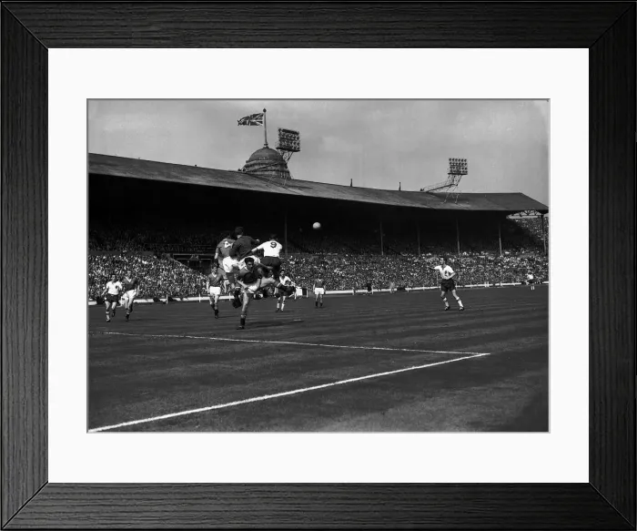 Framed Print : Bolton Wanderers and Manchester United players jump for the ball during FA cup Final Framed Print : Bolton Wanderers and Manchester United players jump for the ball during FA cup Final