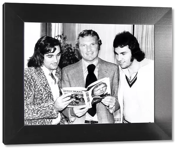 Bobby Moore with George Best and Gerry Francis at the launch of his book called '