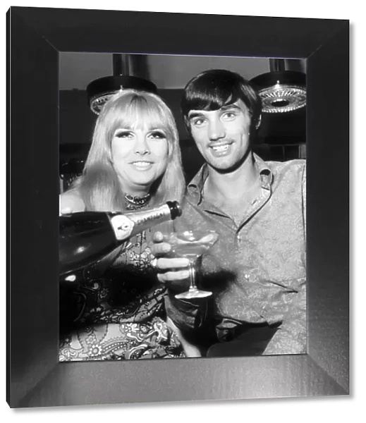 George Best open his boutique in Manchester. The girl topping up George