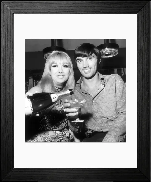 Framed Print : George Best open his boutique in Manchester. The girl topping up George Framed Print : George Best open his boutique in Manchester. The girl topping up George