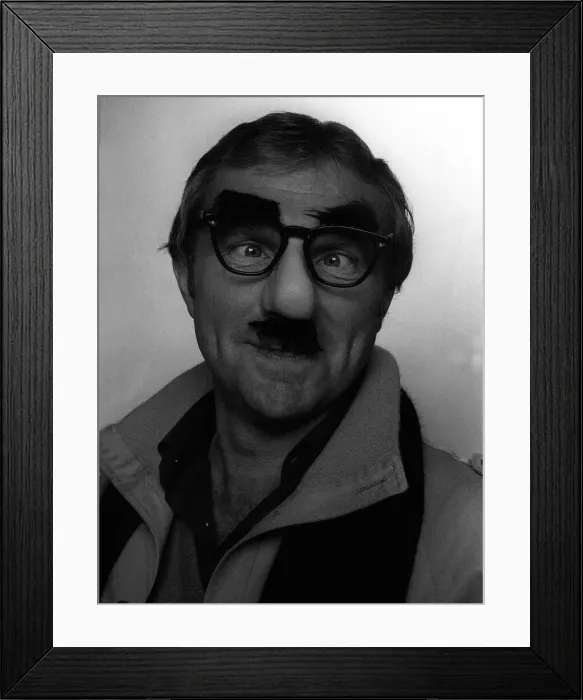 Framed Print : Bobby Moore wearing a Colonel Blimp mask photographed in the Daily Mirror studio Framed Print : Bobby Moore wearing a Colonel Blimp mask photographed in the Daily Mirror studio