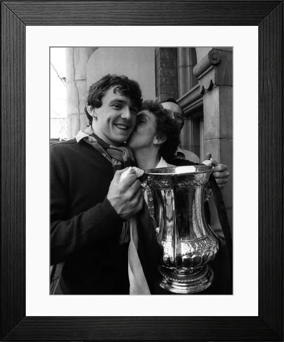 Framed Print : Teenager Paul Allen holds the FA Cup as his mother gives him a kiss on the cheek