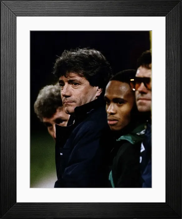 Framed Print : Kevin Keegan manager for Newcastle United watches the game form the dug out