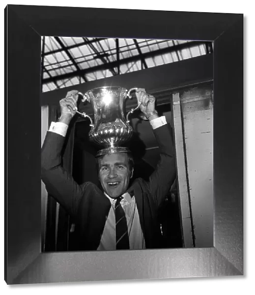 Chelsea Skipper Ron Harris boards the London bound train with the FA Cup after Chelsea