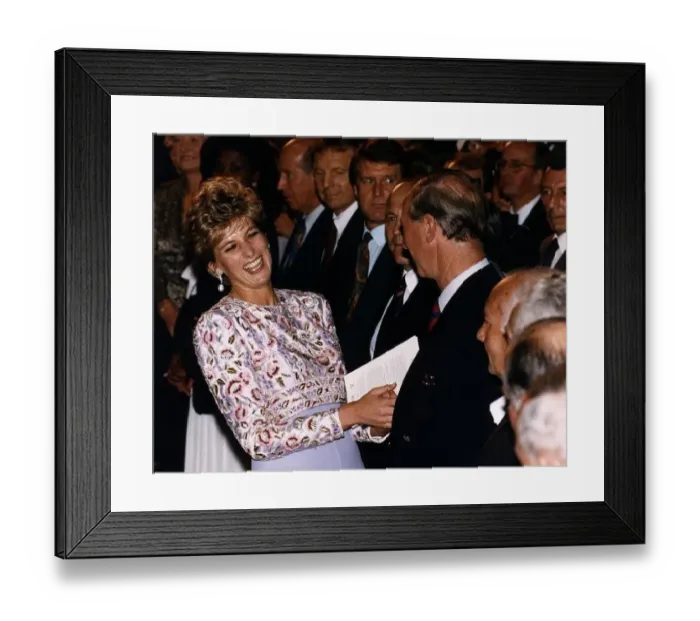  : Princess Diana laughing with Prince Charles after meeting members of England