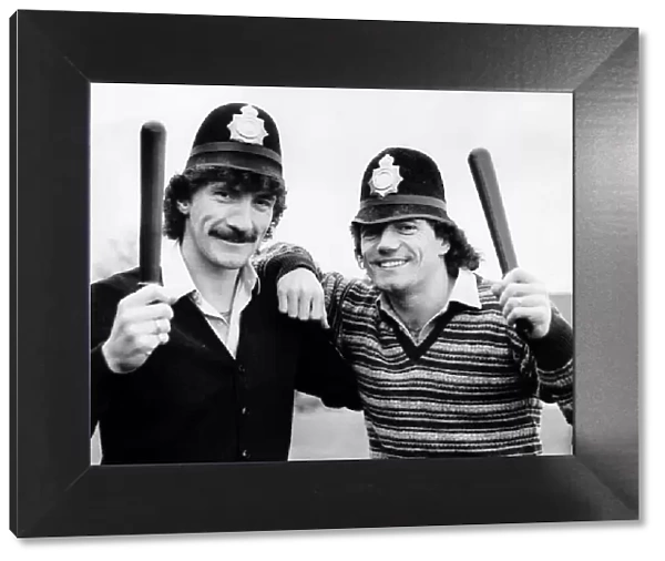 Kevin Keegan and Terry McDermott of Newcastle United with police truncheons