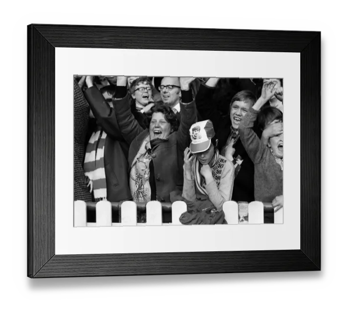 Framed Print : Manchester United Fan wearing George Best hat March 1972 is surrounded by Stoke City fans