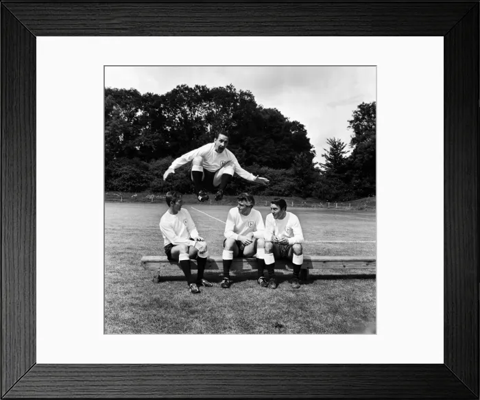 Framed Print : Dave Mackay of Tottenham Hotpurs jumps into the new 1965 / 66 season over teammates Cliff Framed Print : Dave Mackay of Tottenham Hotpurs jumps into the new 1965 / 66 season over teammates Cliff