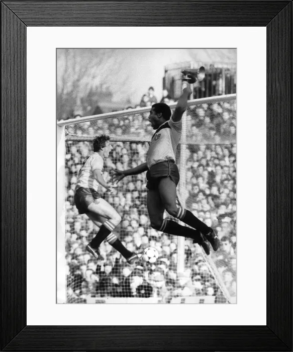 Framed Print : John Barnes of Watford leaps high into the air as he celebrates his second goal against Framed Print : John Barnes of Watford leaps high into the air as he celebrates his second goal against