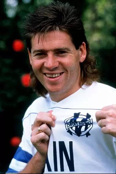 Chris Waddle shows off the Marseille badge after his transfer from Tottenham Hotspur for