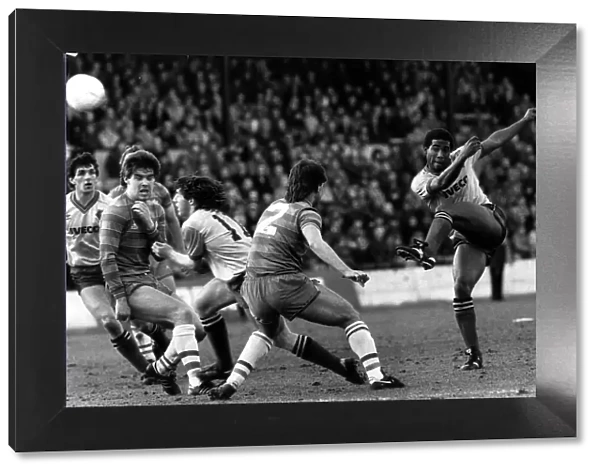 John Barnes of Watford bends the ball around the Chelsea defence for a shot at goal