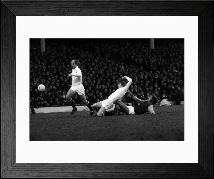 Framed Print : Bobby Charlton and Martin Buchan of Manchester United clear the ball from West Hams Billy