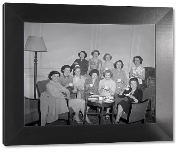 Wives of the Newcastle players seen here gathered together in their London hotel room