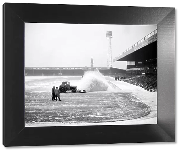 Birmingham grounds staff seen here clearing snow from the pitch. January 1963