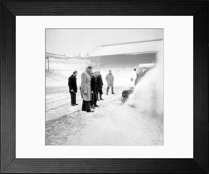 Framed Print : Pitch Inspection. Birmingham grounds staff seen here clearing snow from the pitch Framed Print : Pitch Inspection. Birmingham grounds staff seen here clearing snow from the pitch