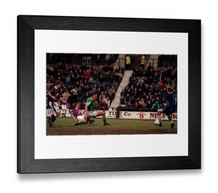 Framed Print : Gary MacKay Hearts football player scores goal past Hibs keeper Jim Leighton
